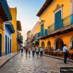 도미니카 연방에서의 치안 문제 - A vibrant street scene in Santo Domingo’s Zona Colonial at dusk, showcasing colorful colonial-style ...
